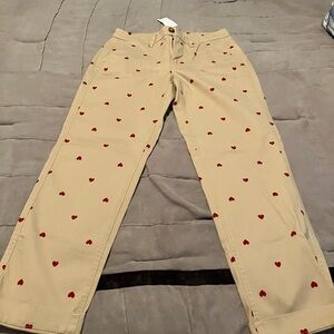 Khaki pants with red hearts